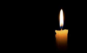 image of a candle in darkness